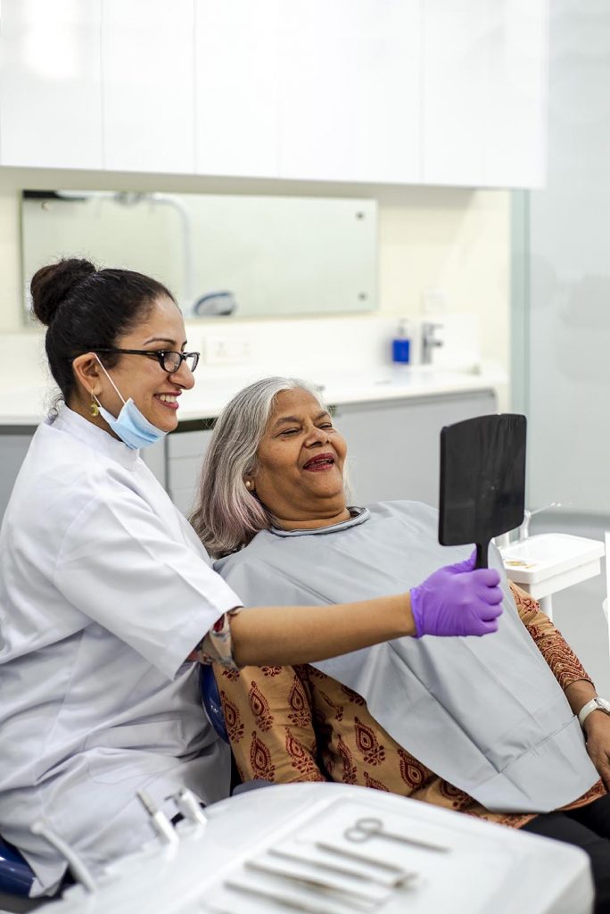 Best Cosmetic Dentist in Gurgaon with Old Lady | Alveo Dental Clinic